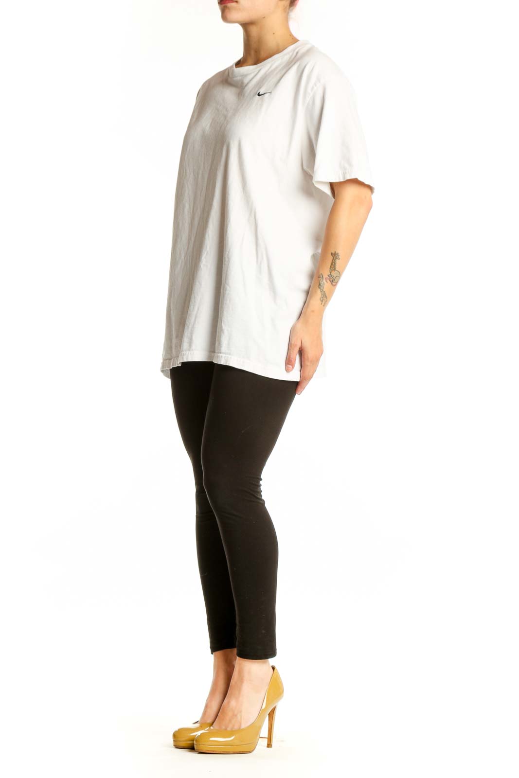 White cotton Nike t-shirt with crew neck and Swoosh logo, front view on model