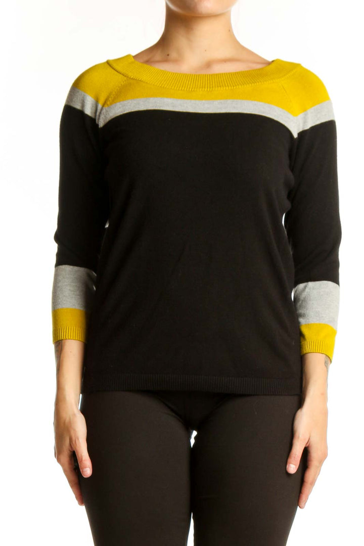 Black and yellow color-block knit sweater with white stripes and three-quarter sleeves, front view