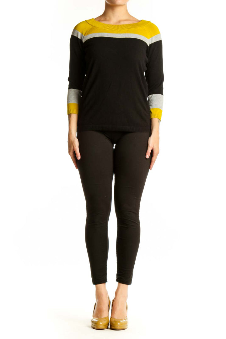 Black and yellow color-block knit sweater with white stripes and three-quarter sleeves, front view