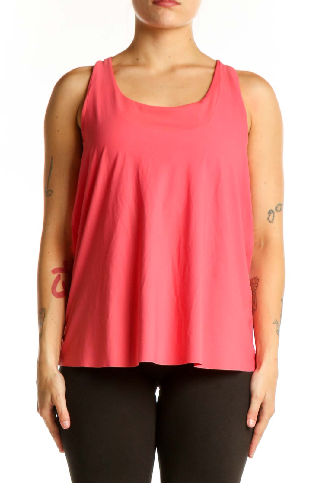 Front view of pink Athleta sleeveless tank top with scoop neckline on model