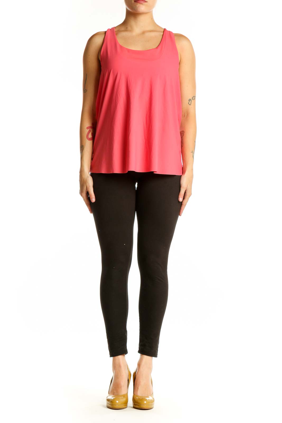 Front view of pink Athleta sleeveless tank top with scoop neckline on model