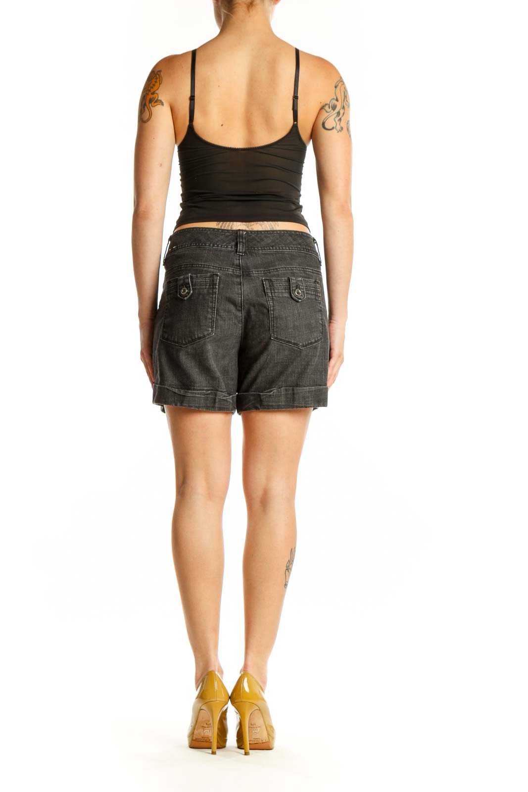 Back view of charcoal denim shorts showing the fit and rolled cuff detail
