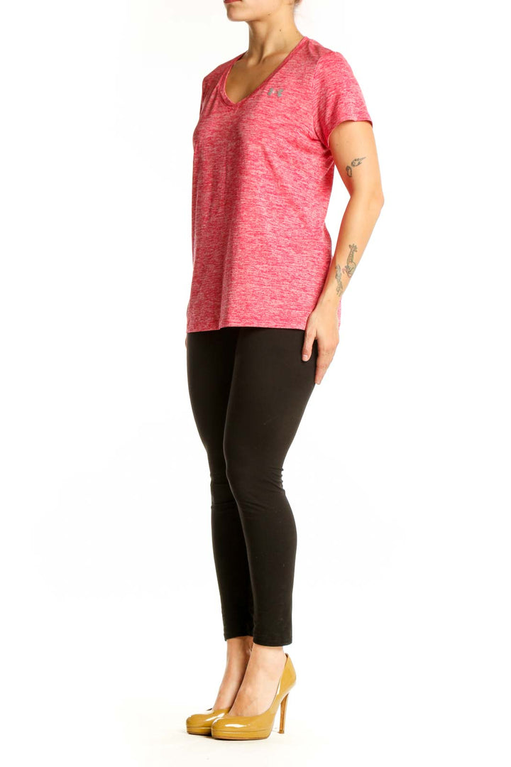 Pink heathered Under Armour V-neck activewear t-shirt front view on model