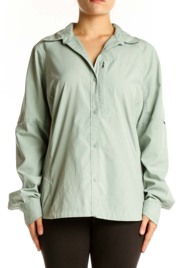 Sage green Columbia button-up activewear shirt front view on model, featuring long sleeves and relaxed fit