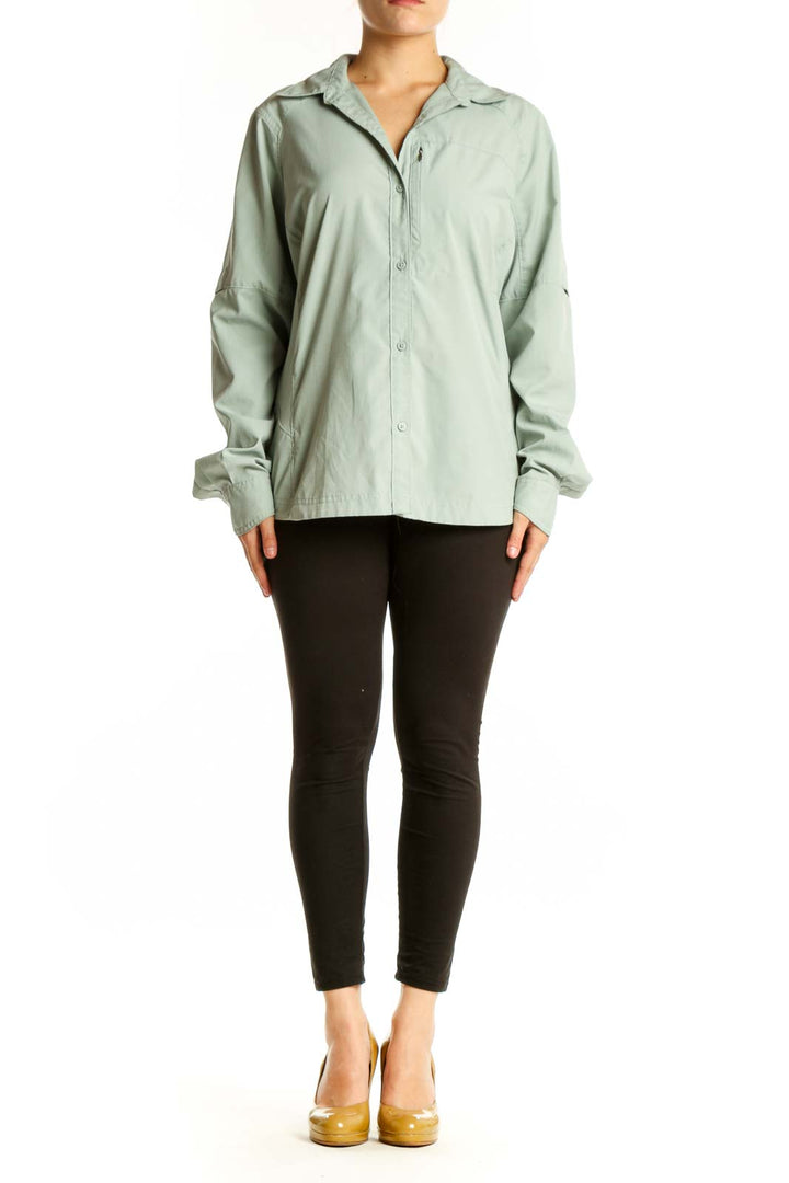 Sage green Columbia button-up activewear shirt front view on model, featuring long sleeves and relaxed fit