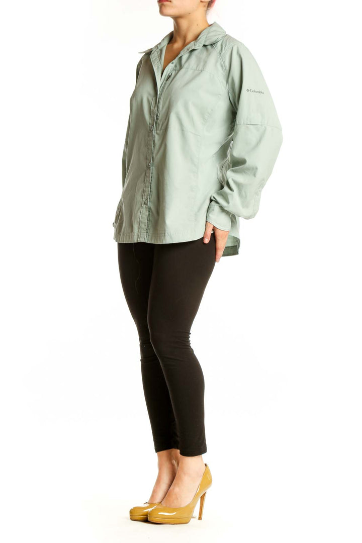 Sage green Columbia button-up activewear shirt front view on model, featuring long sleeves and relaxed fit