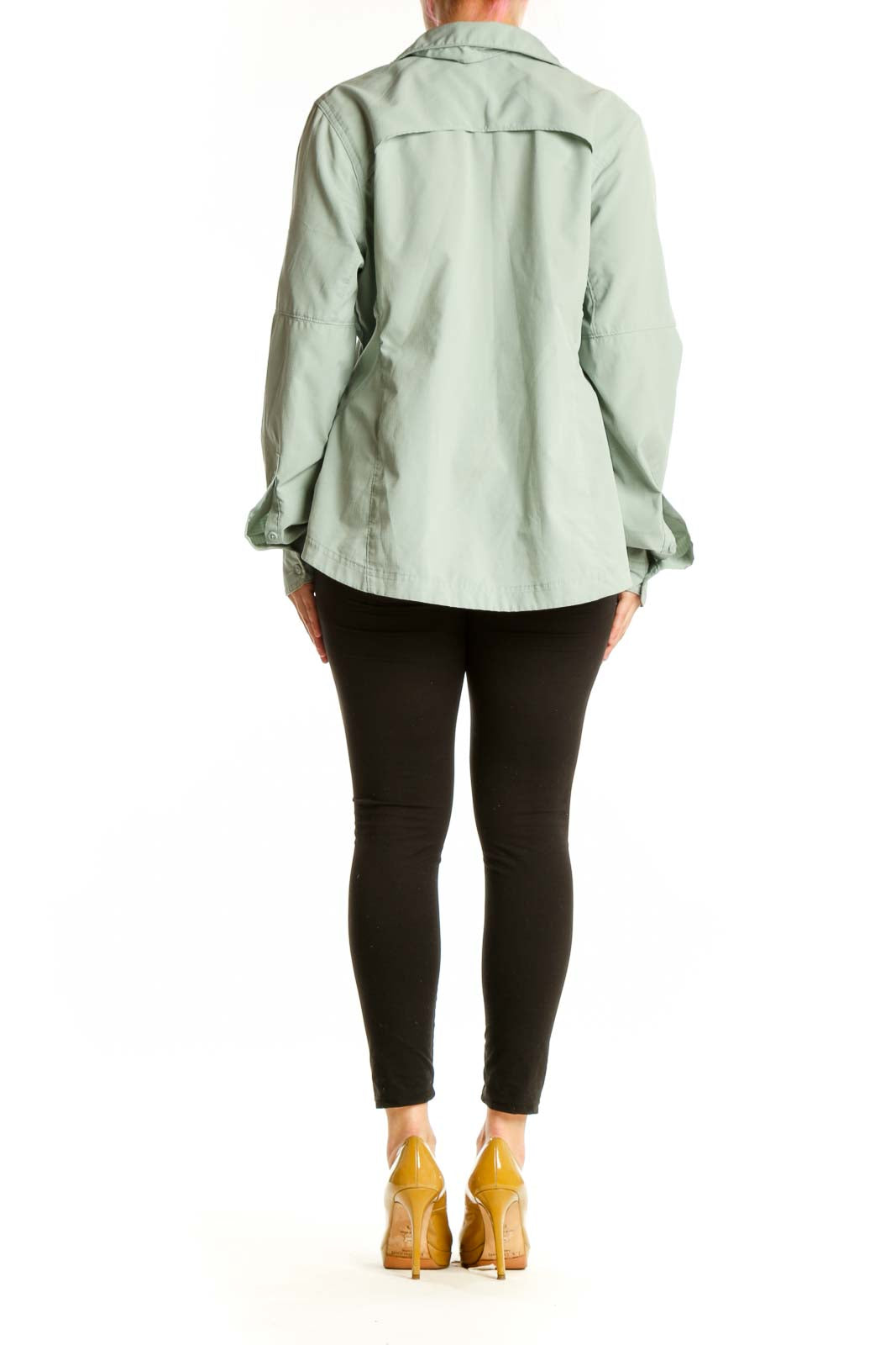 Sage green Columbia activewear shirt back view, showing button-up design and relaxed silhouette