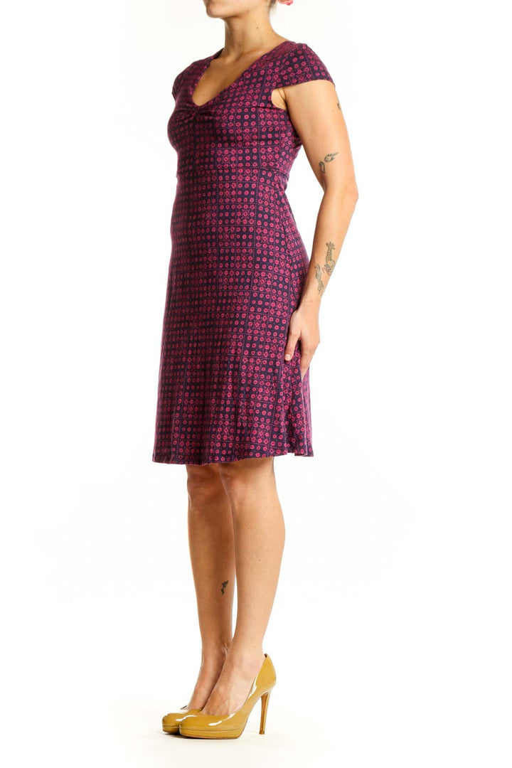 Burgundy geometric print cap sleeve dress with V-neckline, front view on model