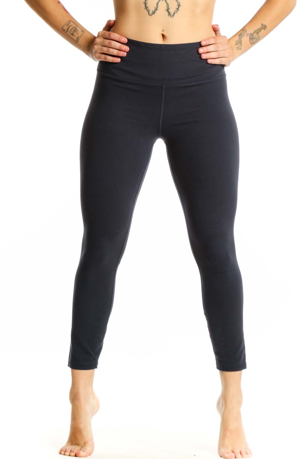 Black Athleta high-waisted capri leggings front view, showcasing form-fitting design and ankle-length cut