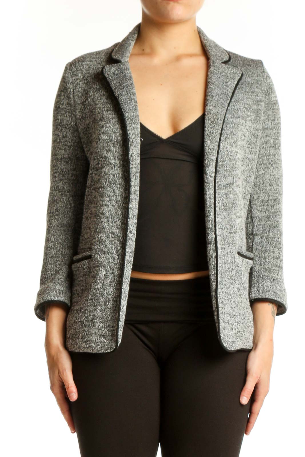 Gray heathered knit blazer with notched lapels and three-quarter sleeves worn over black crop top