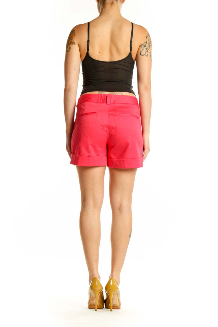 Back view of red cotton-spandex tailored shorts from Express, showing clean lines and flattering fit