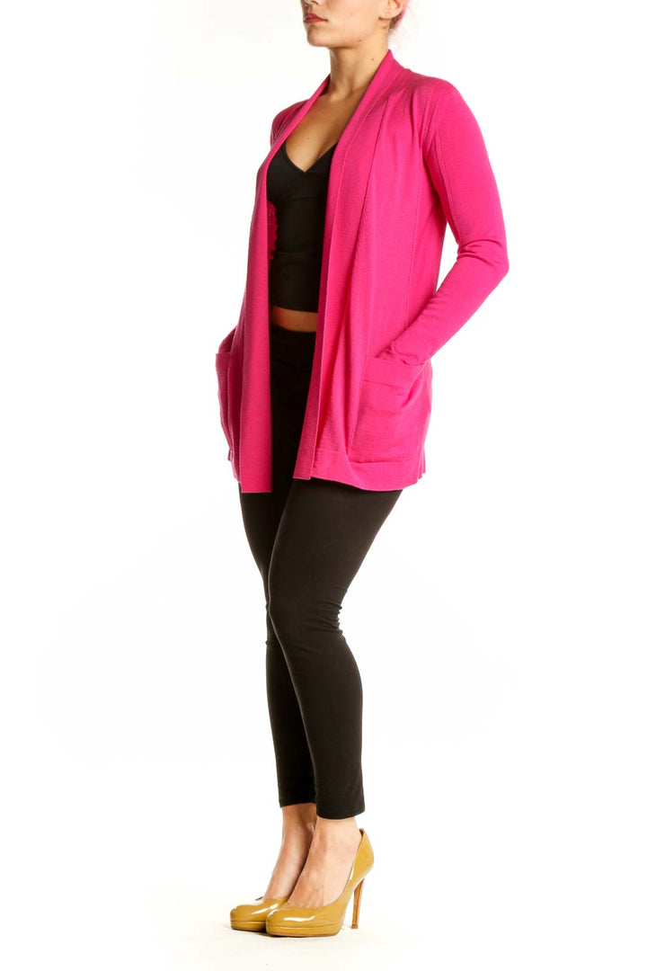 Front view of pink ESCADA silk wool cardigan worn open over black crop top, showing relaxed fit and draping