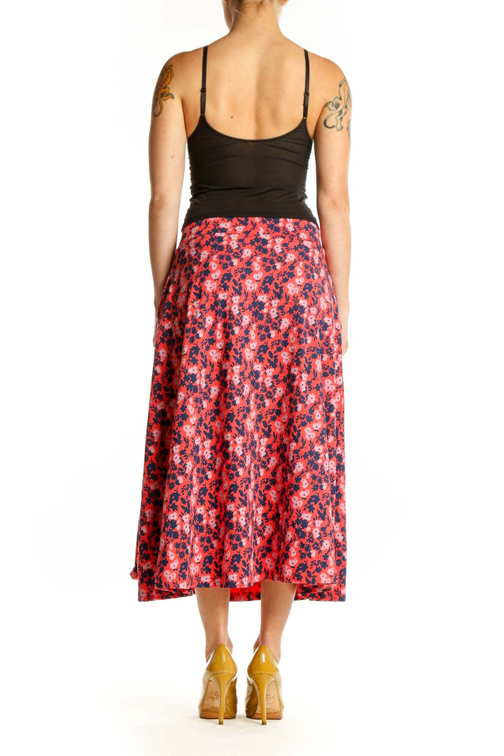 Red floral A-line midi skirt back view showing flattering silhouette and functional pockets