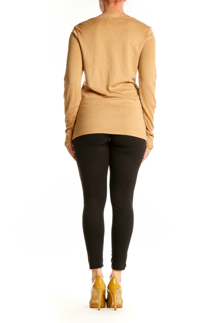 Back view of camel studded knit sweater showing diagonal metallic stud pattern