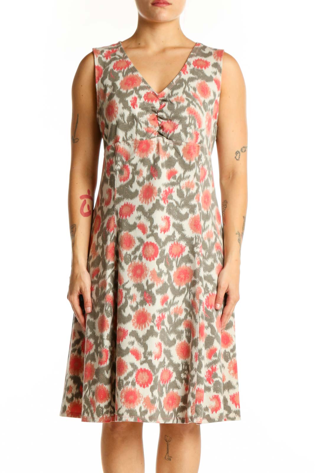 Cream floral midi dress with coral and sage botanical print, V-neckline, sleeveless design, front view