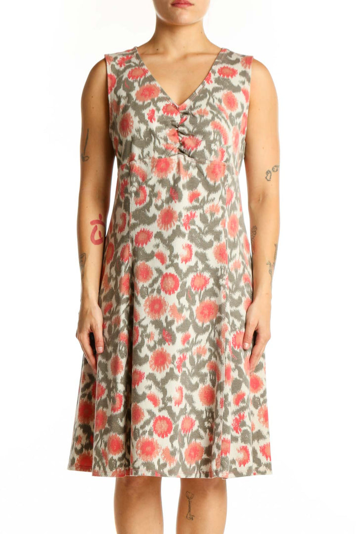 Cream floral midi dress with coral and sage botanical print, V-neckline, sleeveless design, front view