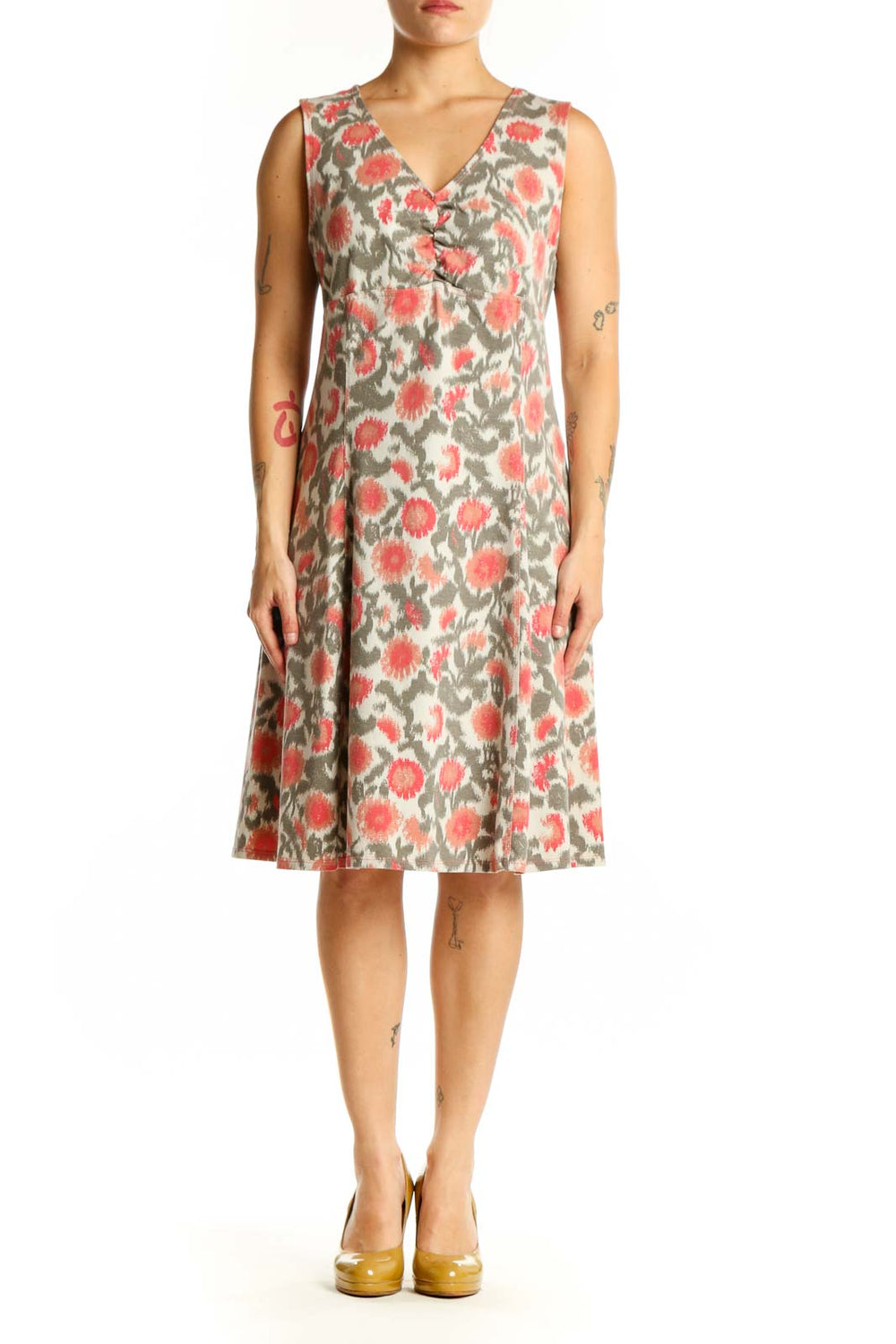 Cream floral midi dress with coral and sage botanical print, V-neckline, sleeveless design, front view