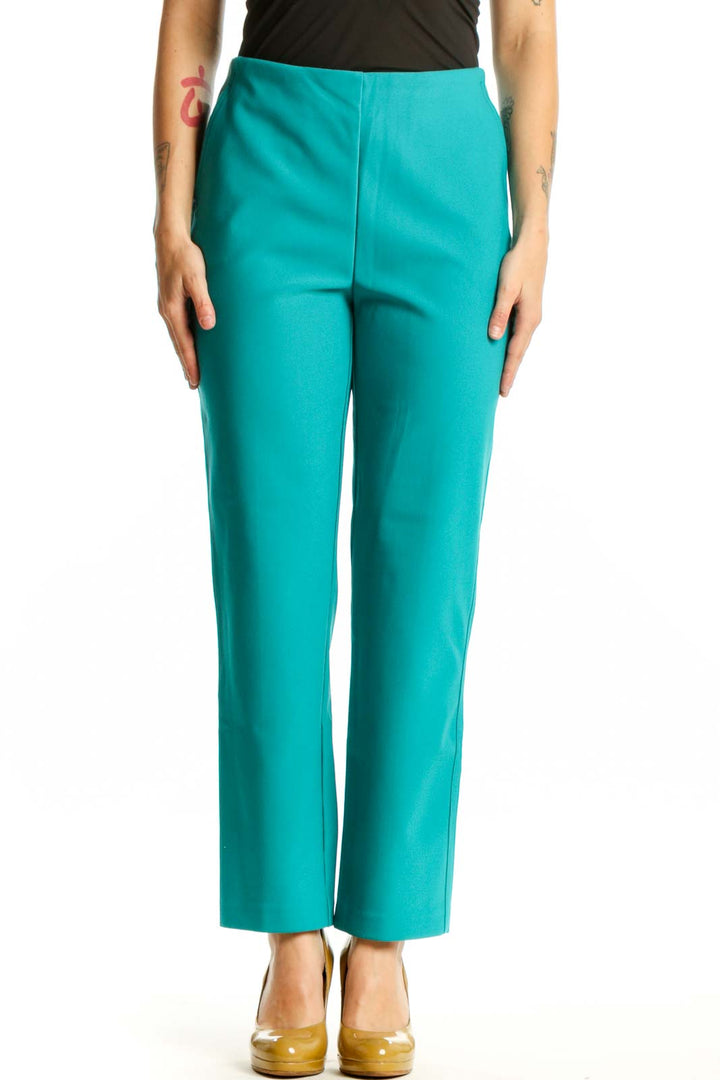 Front view of teal cropped dress pants with high-waisted design and ankle length