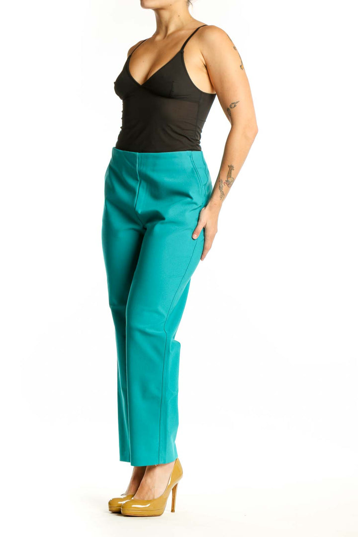 Front view of teal cropped dress pants with high-waisted design and ankle length