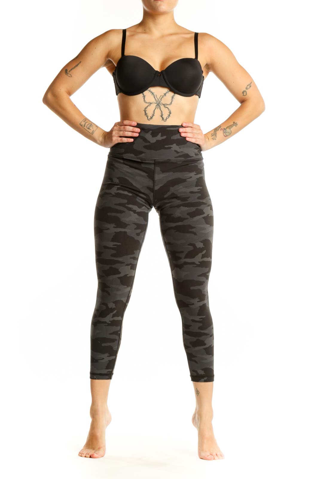 Black camouflage capri leggings with high waistband, front view on model