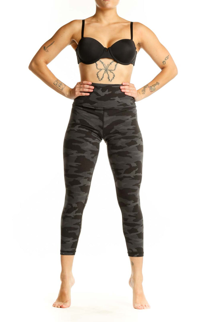 Black camouflage capri leggings with high waistband, front view on model