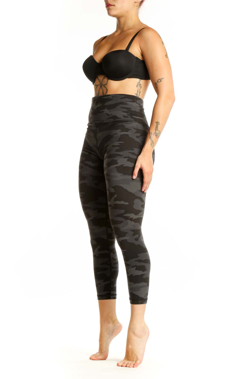 Black camouflage capri leggings with high waistband, front view on model