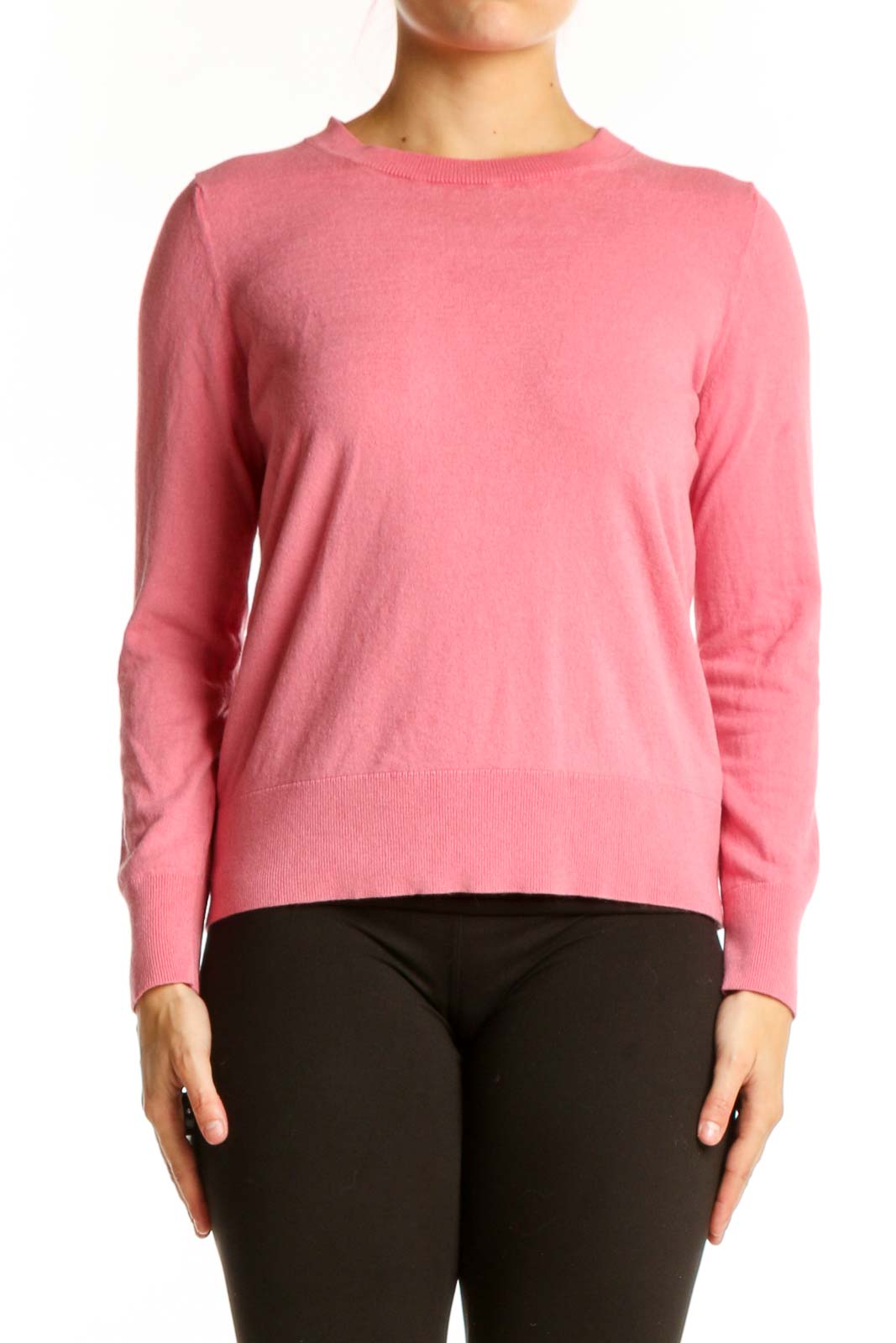 Pink cashmere silk crew neck sweater front view on model wearing black pants