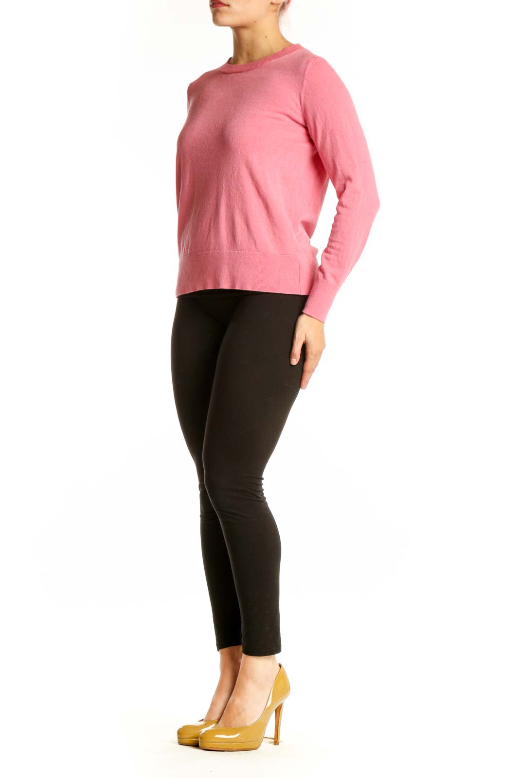Pink cashmere silk crew neck sweater front view on model wearing black pants