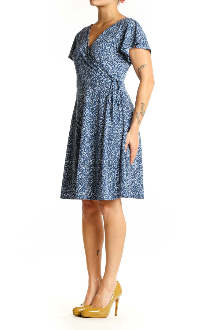 Blue floral wrap midi dress with V-neckline and flutter sleeves, front view