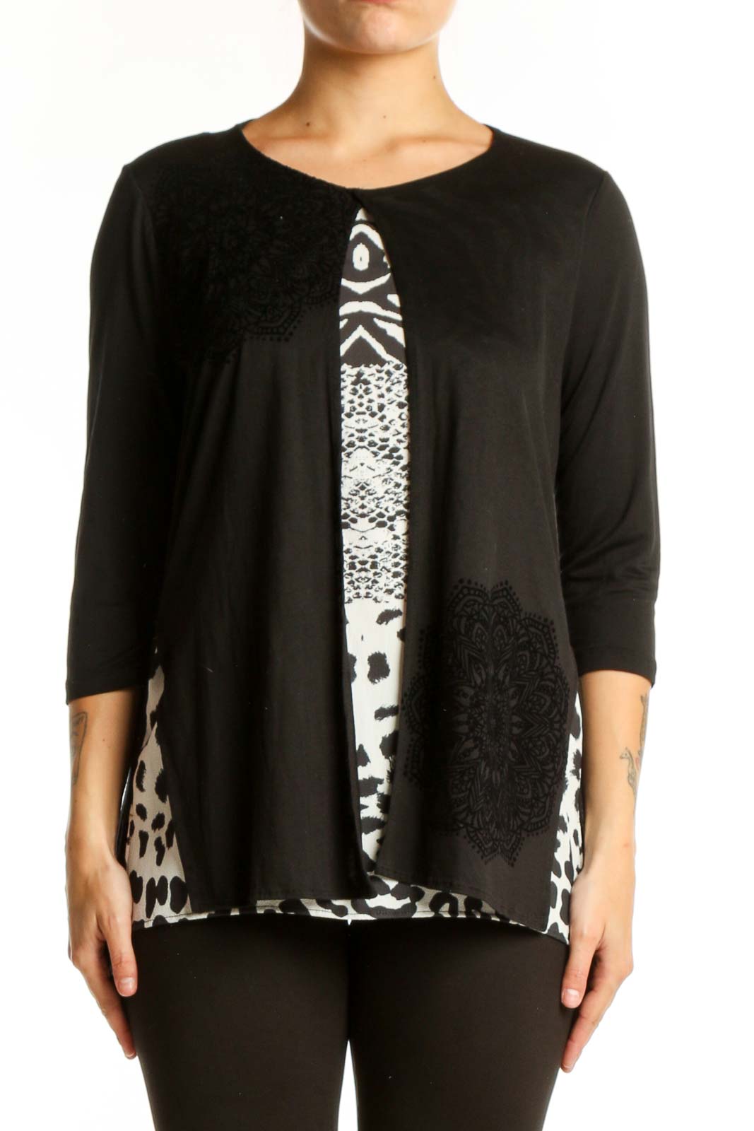 Black Desigual top with mixed white prints including zebra stripes, damask, and leopard spots, three-quarter sleeves, front view