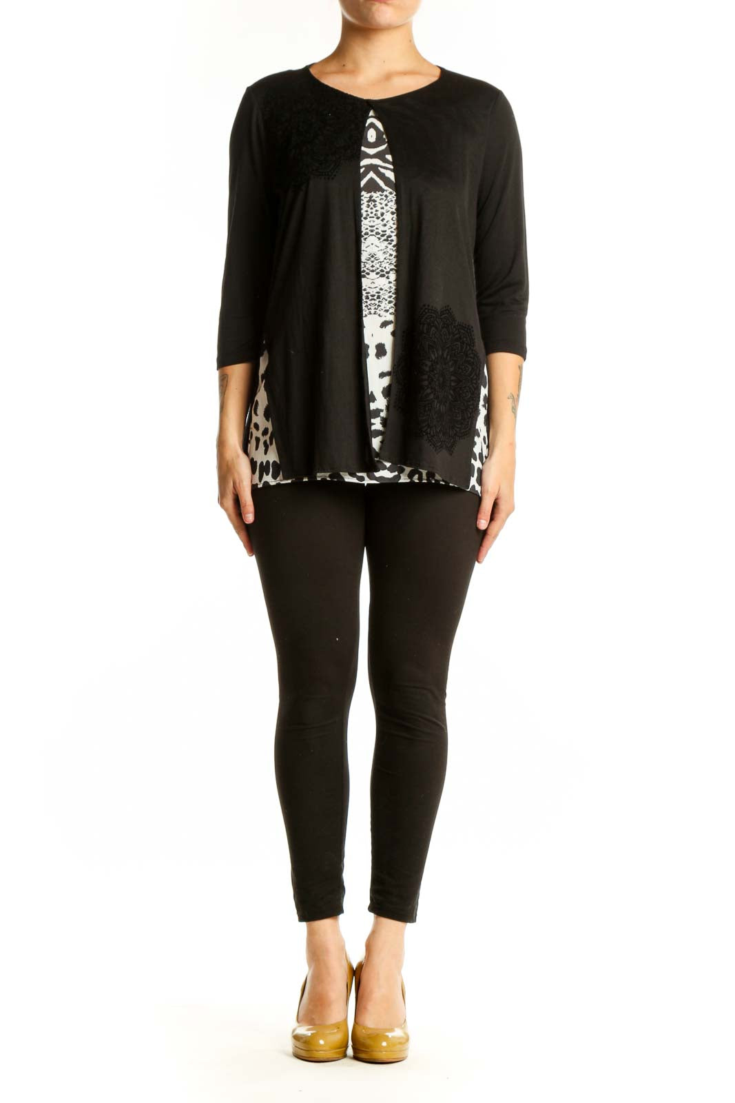 Black Desigual top with mixed white prints including zebra stripes, damask, and leopard spots, three-quarter sleeves, front view