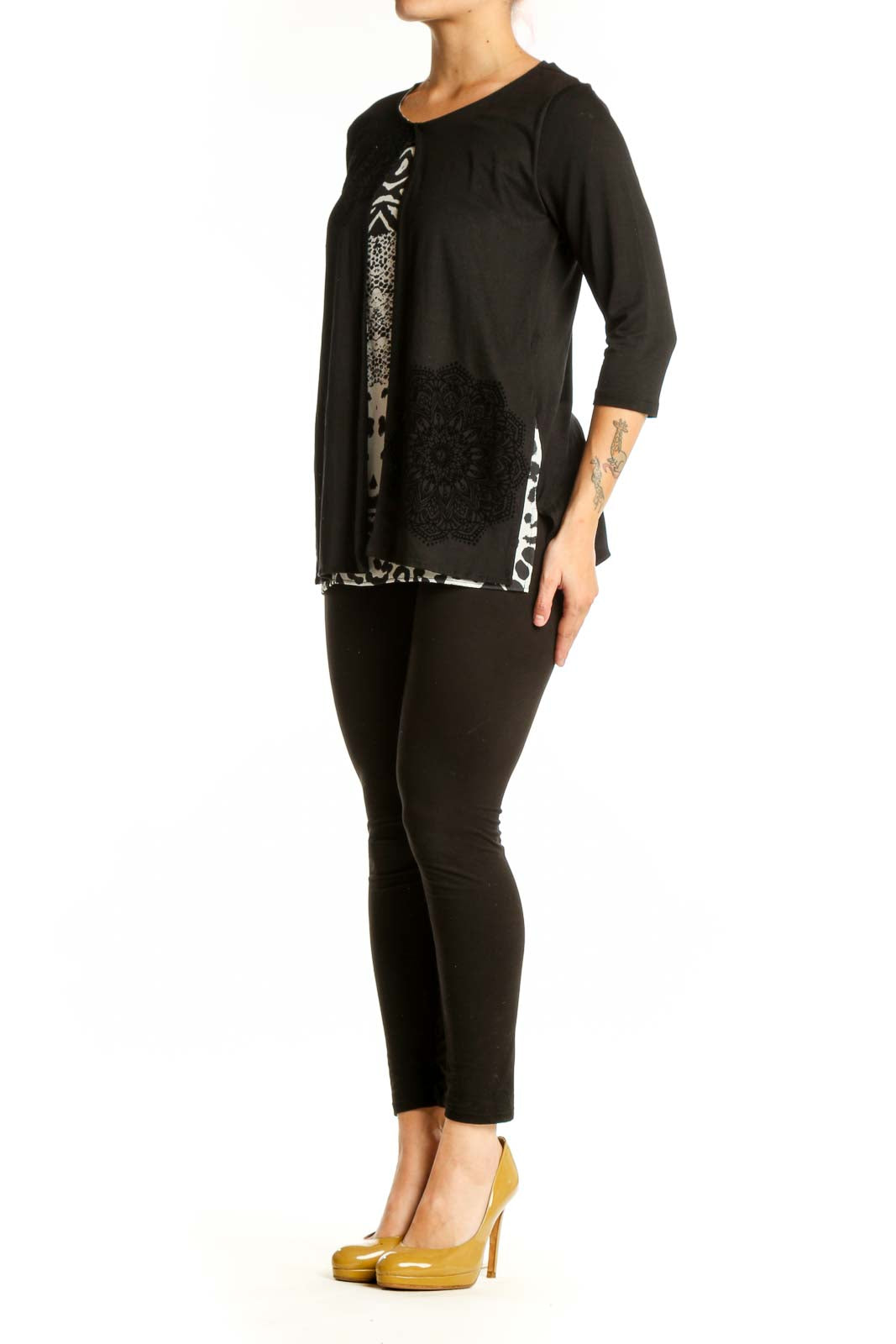 Black Desigual top with mixed white prints including zebra stripes, damask, and leopard spots, three-quarter sleeves, front view