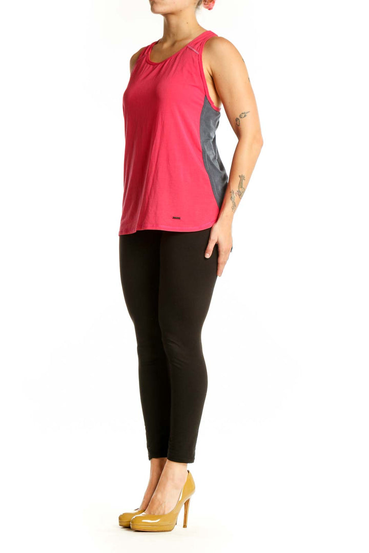 Red SUGOI athletic tank top with scoop neckline and reinforced shoulder straps, front view