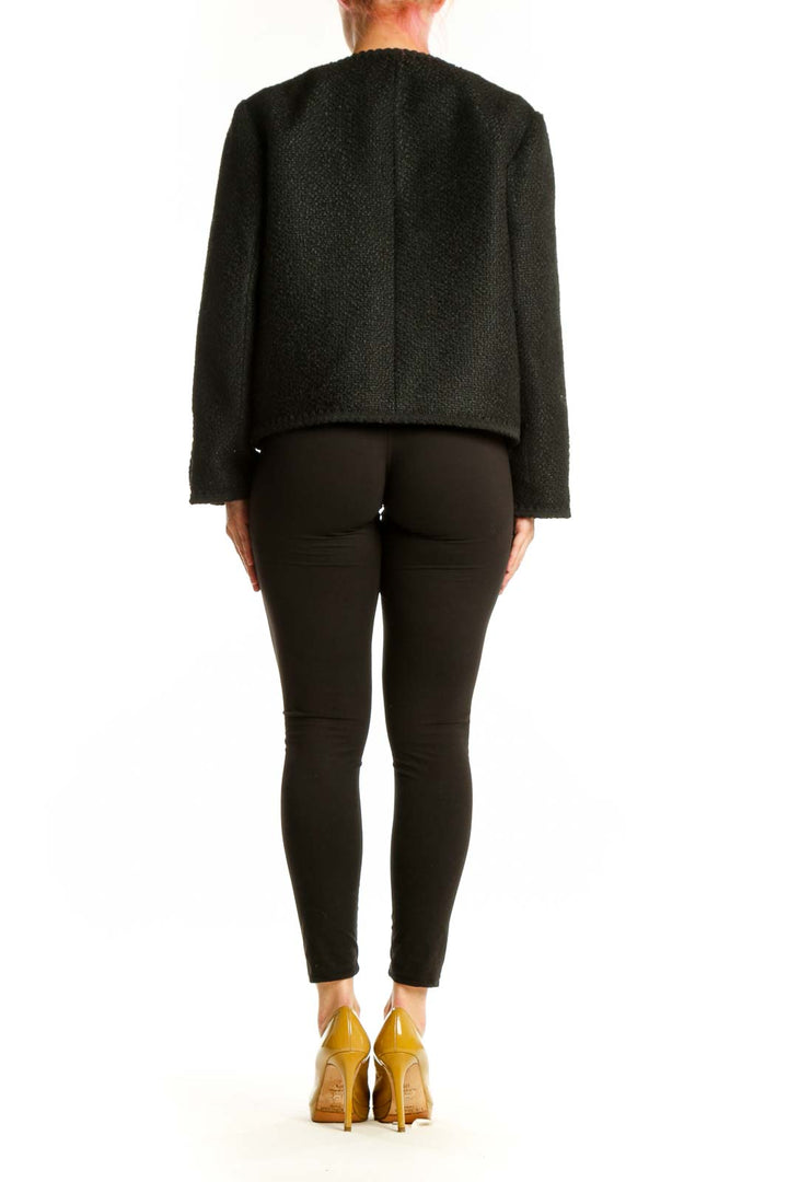 Back view of charcoal wool blazer showing tailored fit and gold button detailing