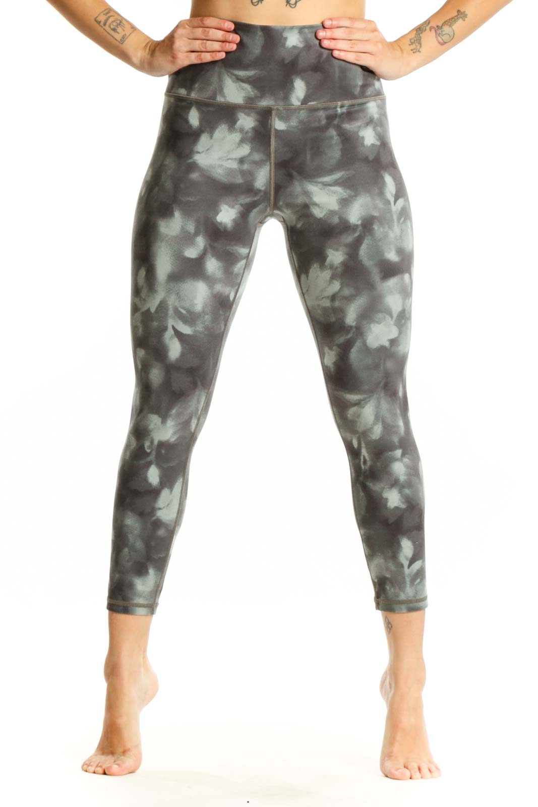 Gray tie-dye high-waisted capri leggings front view showing cropped length and four-way stretch fabric