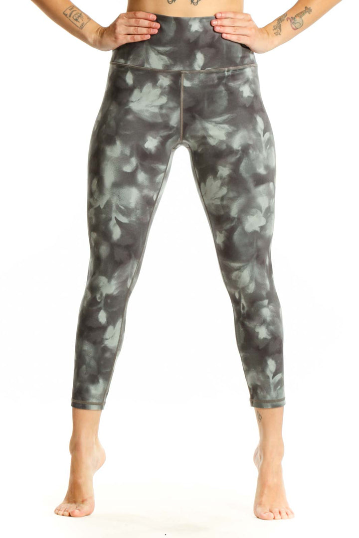 Gray tie-dye high-waisted capri leggings front view showing cropped length and four-way stretch fabric