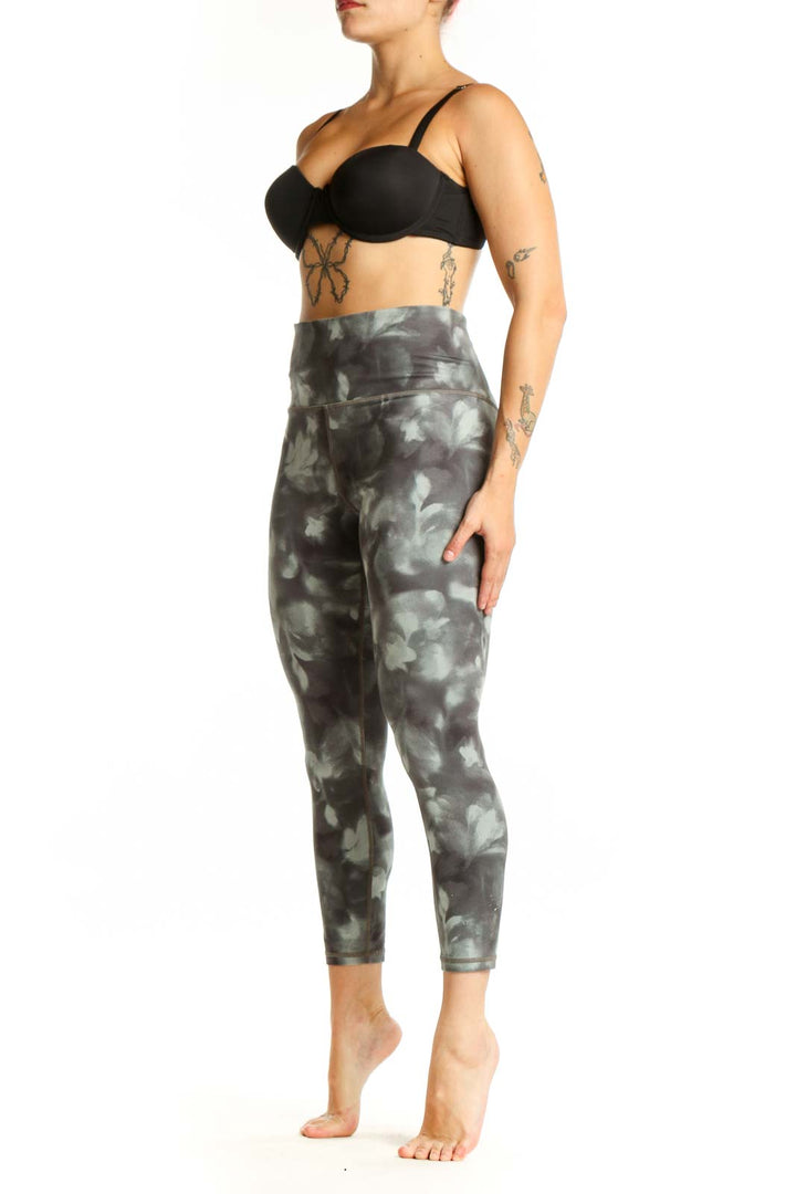 Gray tie-dye high-waisted capri leggings front view showing cropped length and four-way stretch fabric