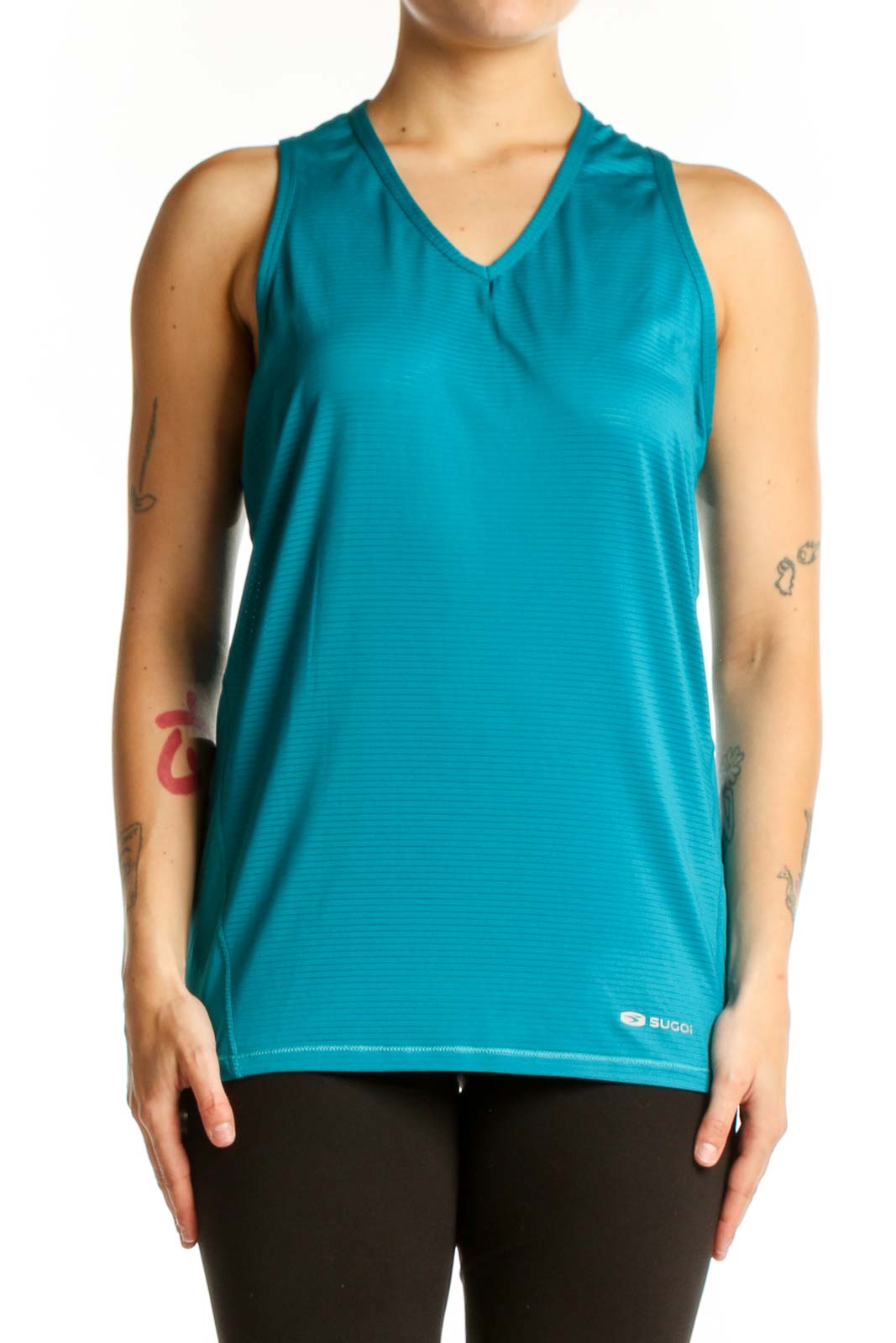 Teal V-neck sleeveless activewear tank top by SUGOI, front view on model