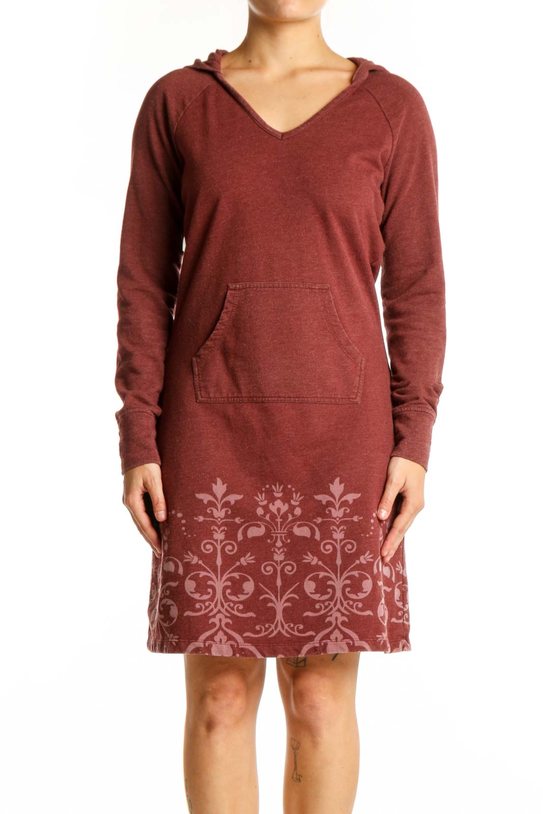 Burgundy hooded dress with damask print pattern on lower portion, featuring long sleeves and front pockets