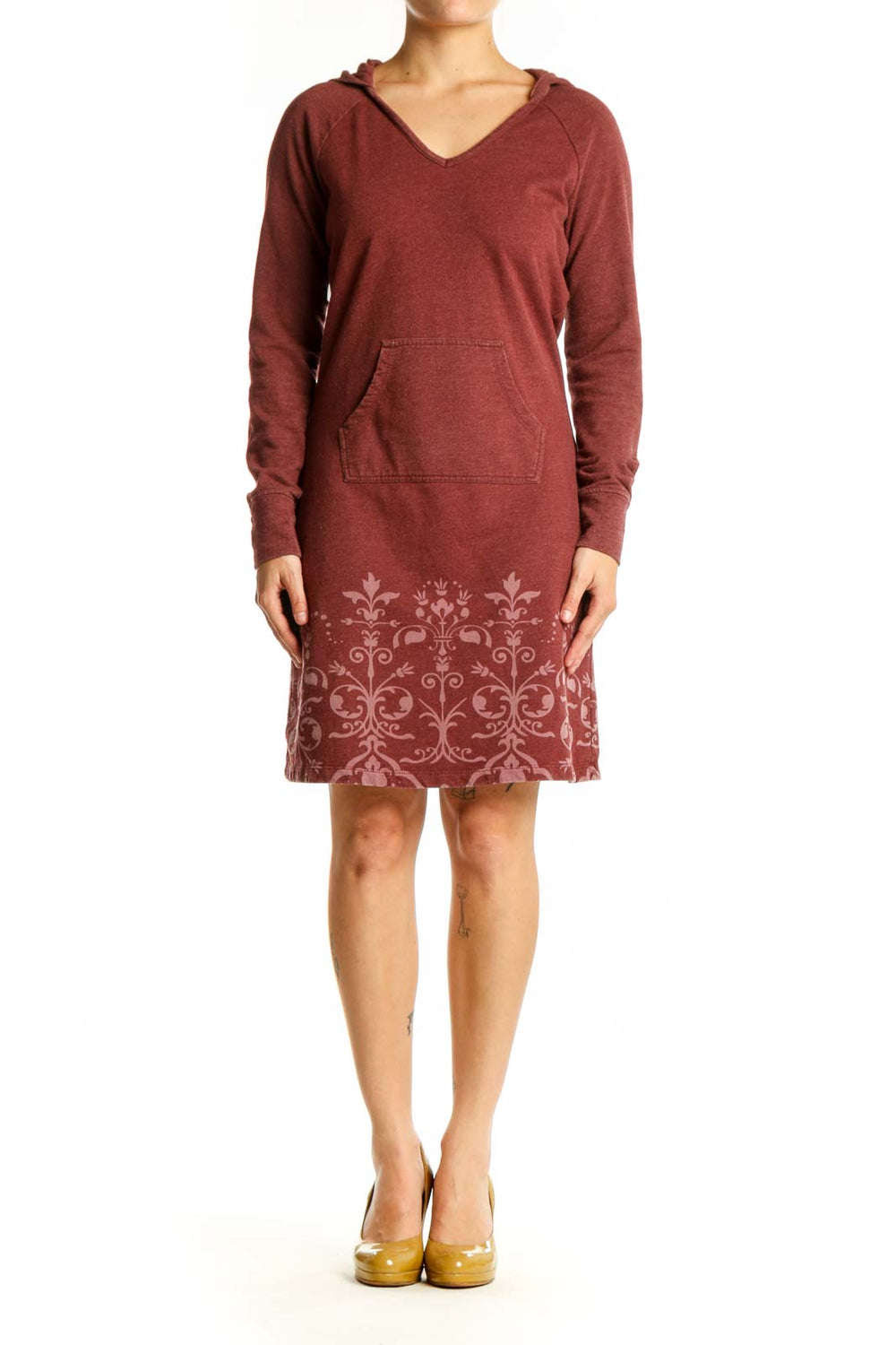 Burgundy hooded dress with damask print pattern on lower portion, featuring long sleeves and front pockets