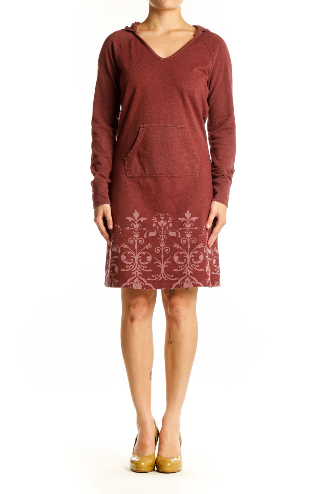 Burgundy hooded dress with damask print pattern on lower portion, featuring long sleeves and front pockets