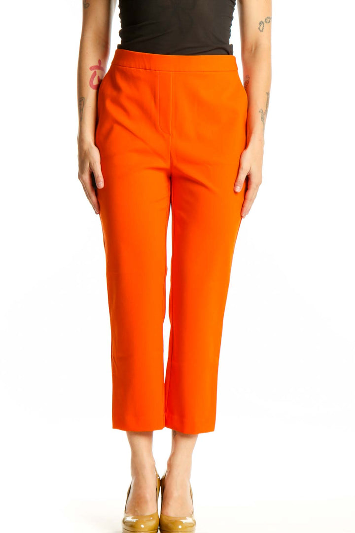 Front view of vibrant orange cropped pants by Rachel Zoe with high-waisted design and ankle length