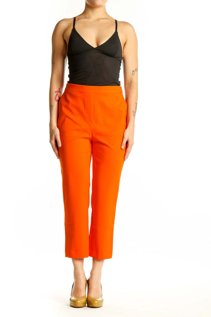 Front view of vibrant orange cropped pants by Rachel Zoe with high-waisted design and ankle length
