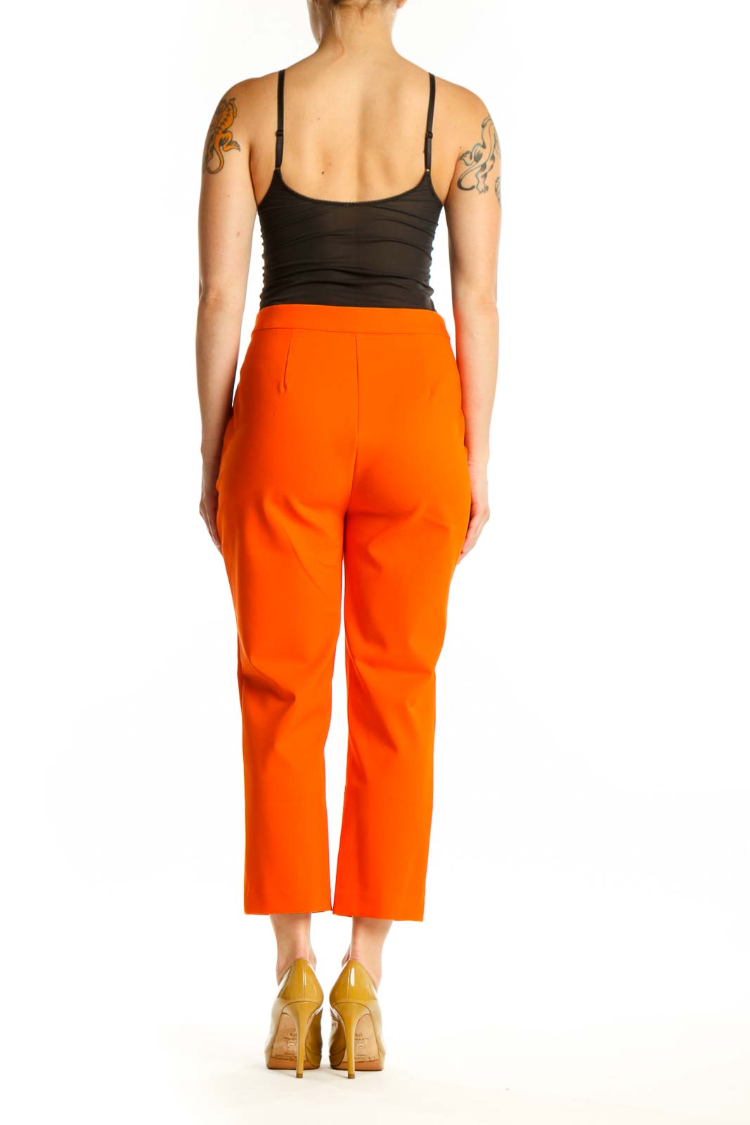 Back view of orange cropped pants by Rachel Zoe showing sleek silhouette and fit