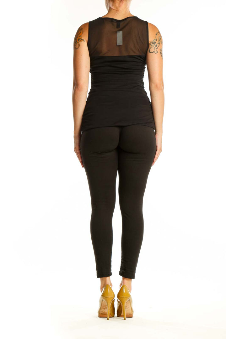 Black ruched sleeveless tank top with side ruching detail, back view on model
