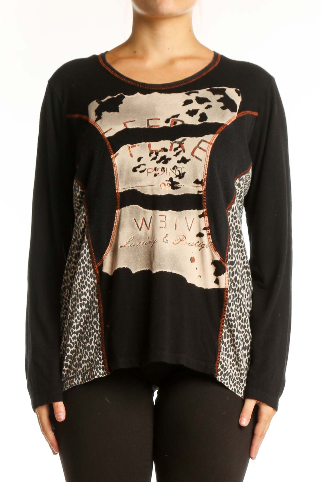 Black mixed pattern long sleeve top with cream, beige, and rust accents featuring animal print and geometric designs