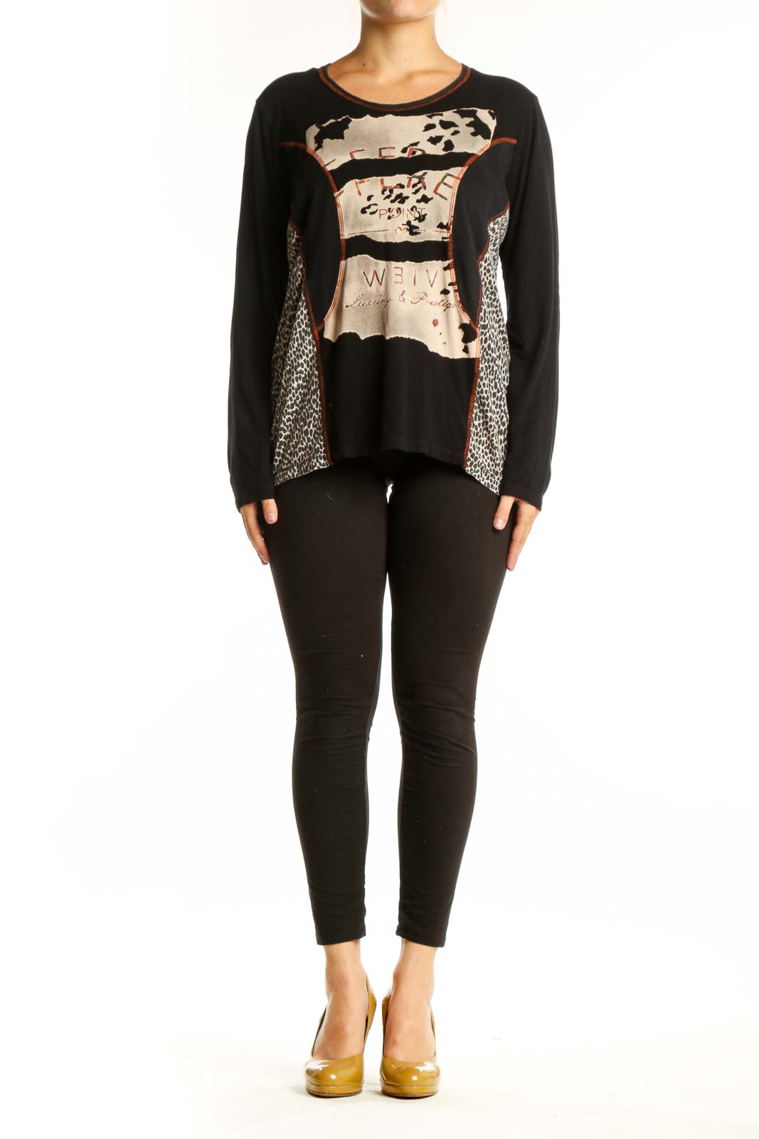 Black mixed pattern long sleeve top with cream, beige, and rust accents featuring animal print and geometric designs