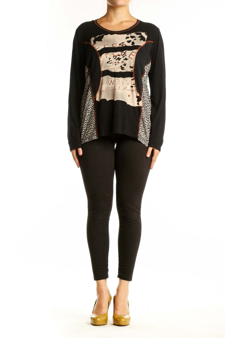 Black mixed pattern long sleeve top with cream, beige, and rust accents featuring animal print and geometric designs