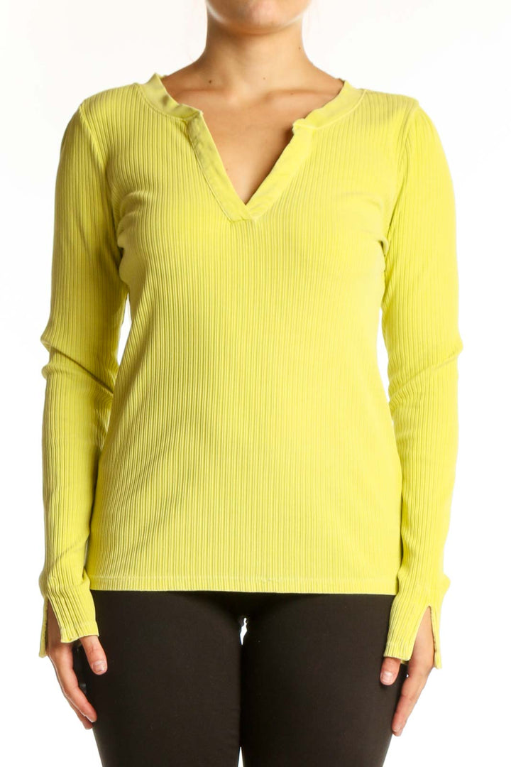 Yellow ribbed henley knit top with button neckline and long sleeves, front view