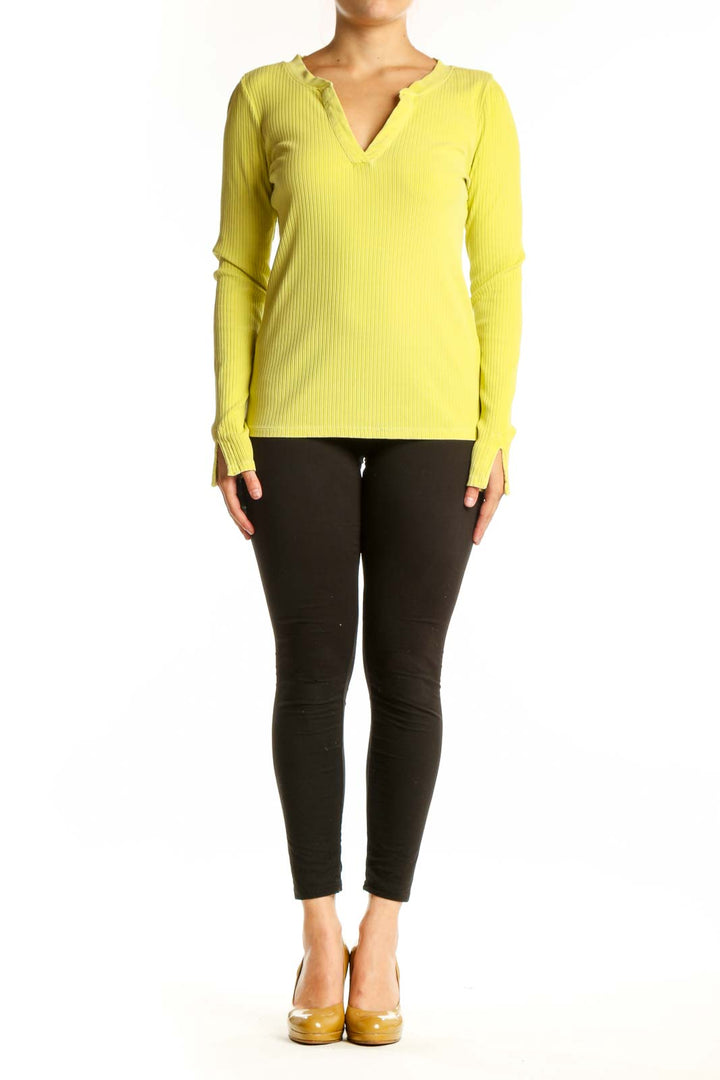 Yellow ribbed henley knit top with button neckline and long sleeves, front view